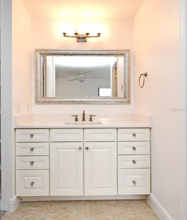 bathroom featuring baseboards, vanity, and ceiling fan