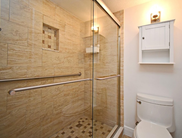 full bath with a shower stall and toilet