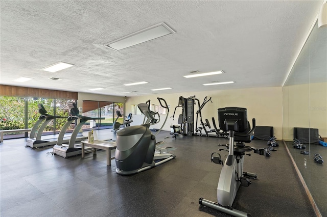 workout area with a textured ceiling