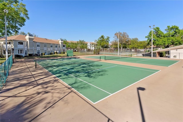 view of sport court featuring community basketball court and fence