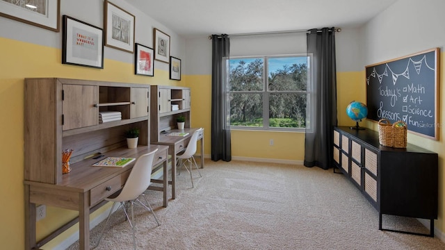 home office featuring baseboards and carpet