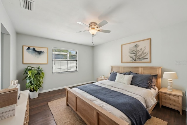 bedroom with ceiling fan, visible vents, baseboards, and dark wood finished floors