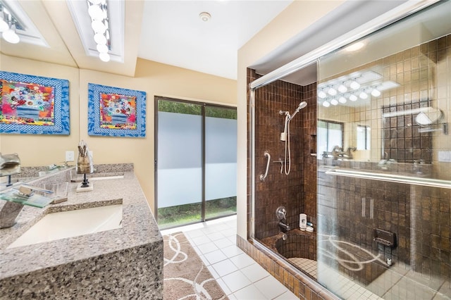 full bathroom featuring a shower stall, a healthy amount of sunlight, and a sink