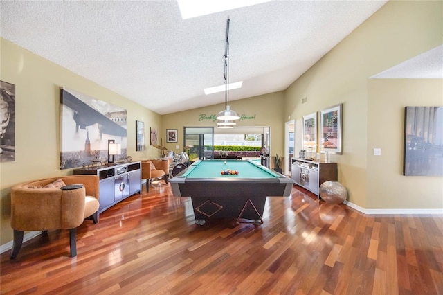 recreation room with billiards, a textured ceiling, dark wood finished floors, baseboards, and vaulted ceiling