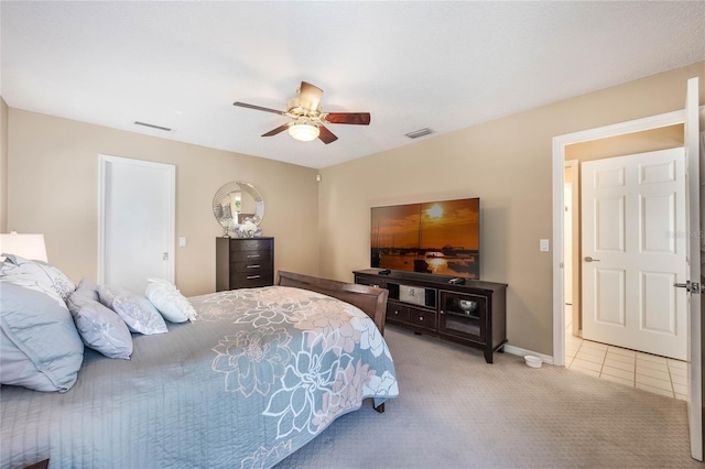 bedroom featuring visible vents, baseboards, ceiling fan, and carpet flooring