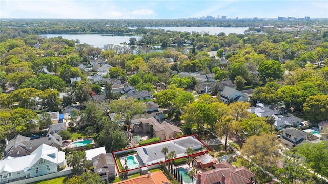 drone / aerial view with a residential view and a water view