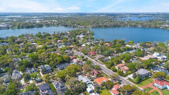 drone / aerial view featuring a water view and a residential view