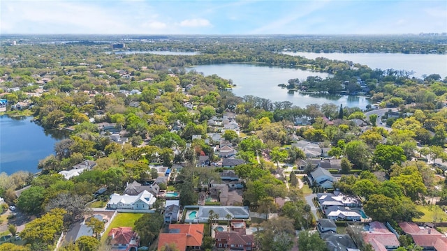 birds eye view of property with a residential view and a water view