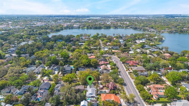 drone / aerial view featuring a residential view and a water view