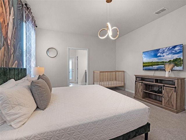 bedroom featuring visible vents, carpet floors, and a chandelier