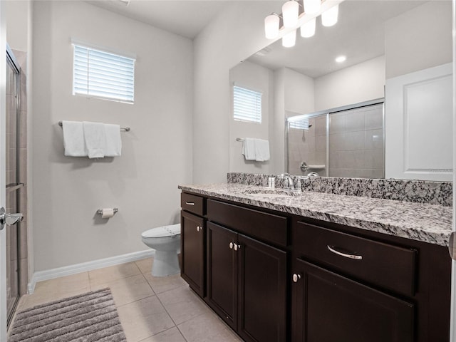 full bathroom featuring tile patterned flooring, a shower stall, baseboards, toilet, and vanity