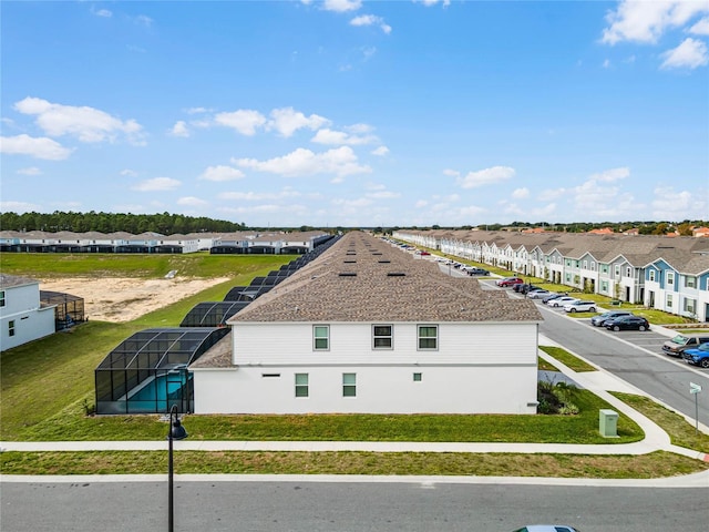 birds eye view of property with a residential view