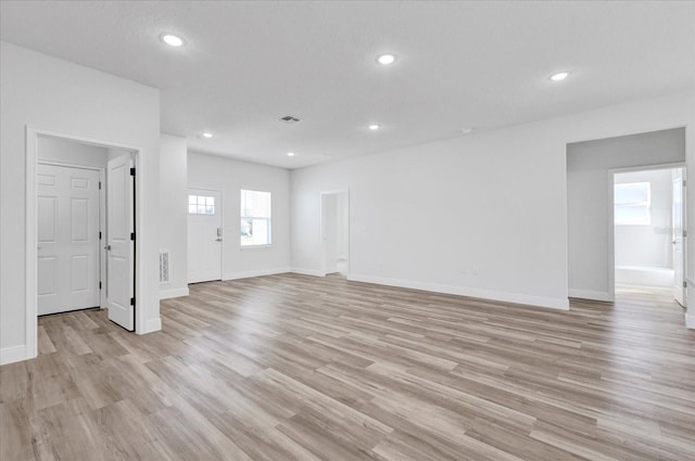 empty room with visible vents, recessed lighting, and light wood-style floors