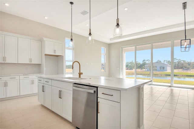 kitchen with visible vents, an island with sink, a sink, white cabinetry, and dishwasher