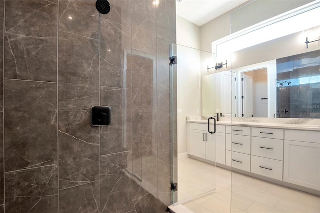 full bath with a shower stall and double vanity