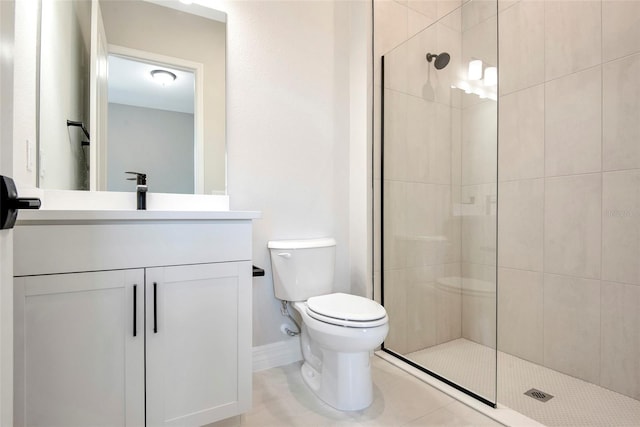 full bathroom featuring tile patterned floors, toilet, tiled shower, and vanity