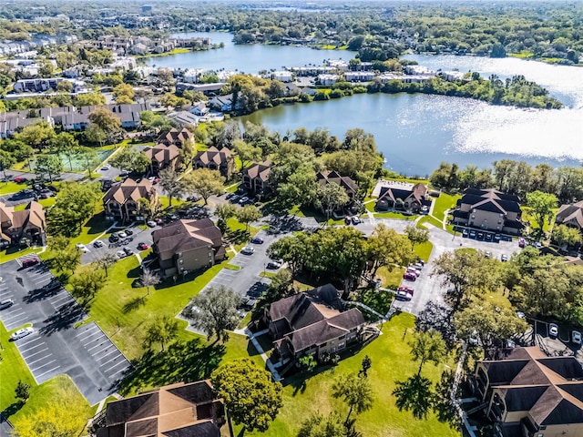 aerial view with a residential view and a water view