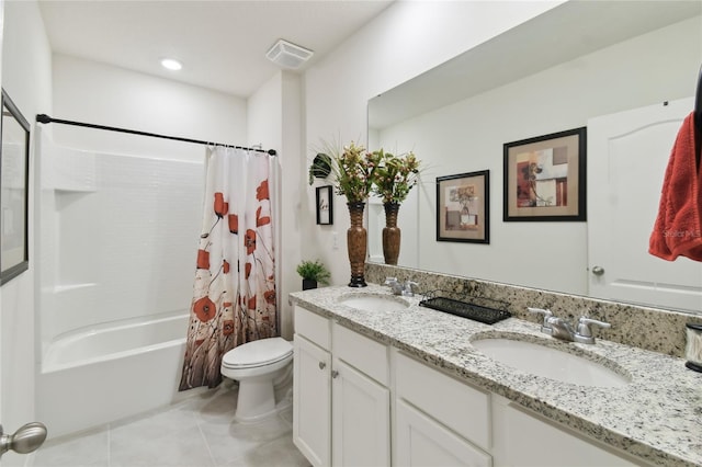 bathroom featuring tile patterned flooring, toilet, visible vents, and a sink