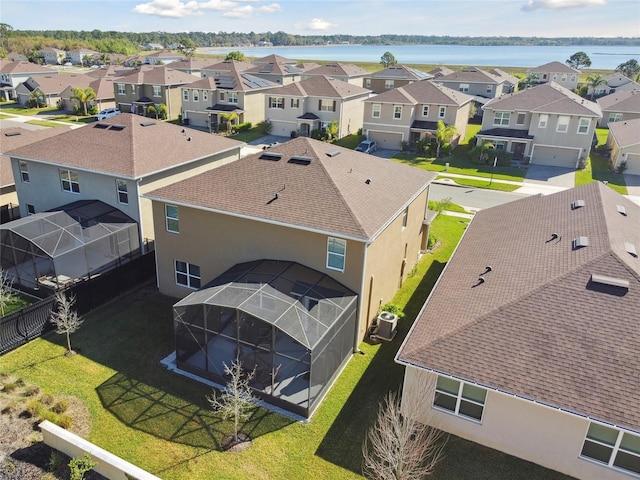 birds eye view of property with a residential view