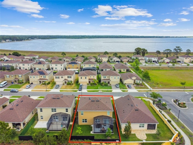 aerial view with a water view and a residential view