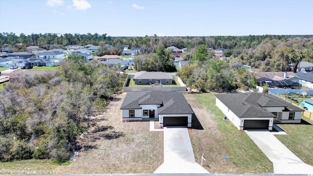 birds eye view of property with a residential view