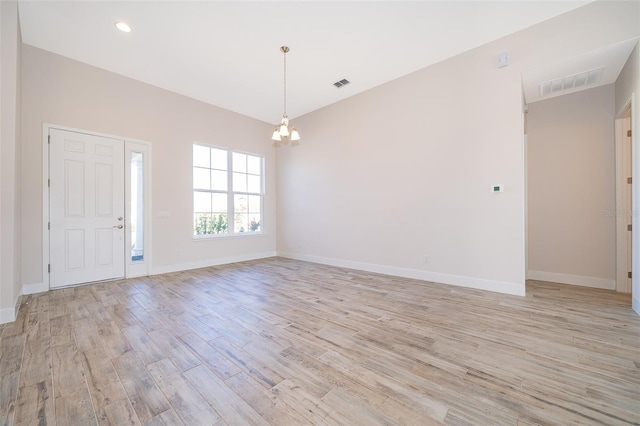 2400 Symphony Cir, Saint Cloud, FL 34771 - entryway featuring light wood-style floors, a notable chandelier, and visible vents