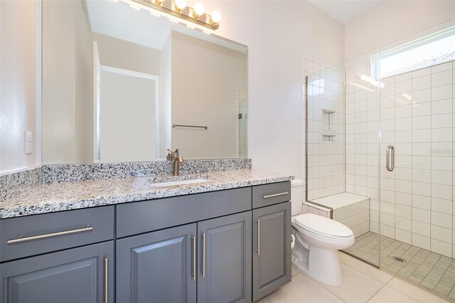 2400 Symphony Cir, Saint Cloud, FL 34771 - bathroom featuring toilet, a stall shower, vanity, and tile patterned flooring