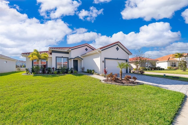 2400 Symphony Cir, Saint Cloud, FL 34771 - mediterranean / spanish-style home with stucco siding, driveway, a front yard, a garage, and a tiled roof