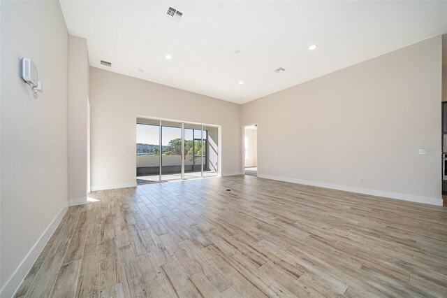 2400 Symphony Cir, Saint Cloud, FL 34771 - spare room with light wood-style flooring, baseboards, and visible vents