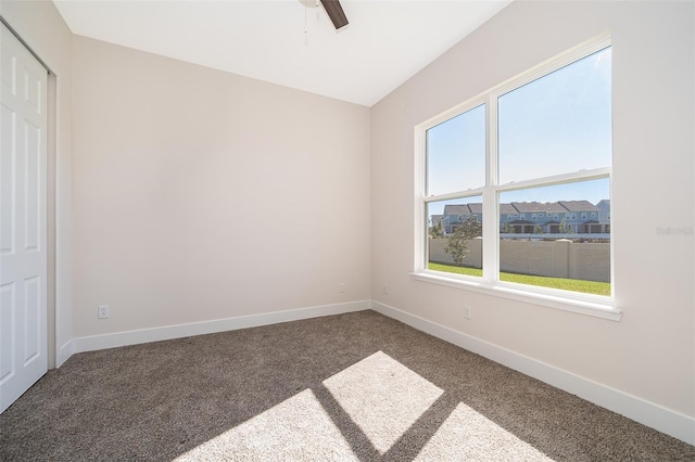2400 Symphony Cir, Saint Cloud, FL 34771 - unfurnished room with carpet flooring, baseboards, and ceiling fan
