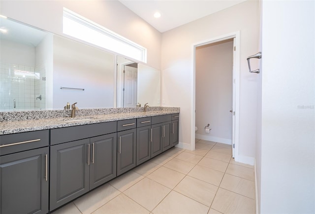 2400 Symphony Cir, Saint Cloud, FL 34771 - bathroom featuring double vanity, tile patterned flooring, toilet, a shower stall, and a sink