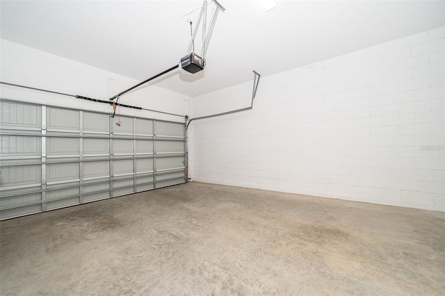 2400 Symphony Cir, Saint Cloud, FL 34771 - garage with concrete block wall and a garage door opener