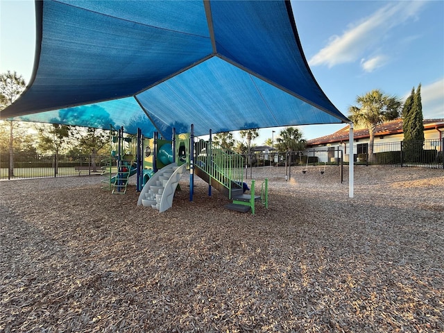 community jungle gym featuring fence