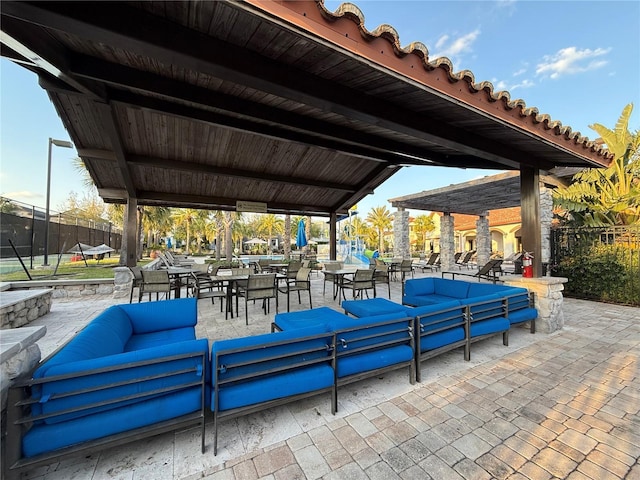 view of patio / terrace with outdoor lounge area and fence