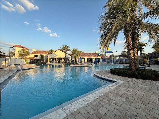 community pool with a patio area