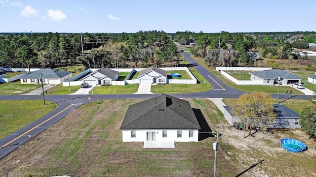 birds eye view of property with a residential view