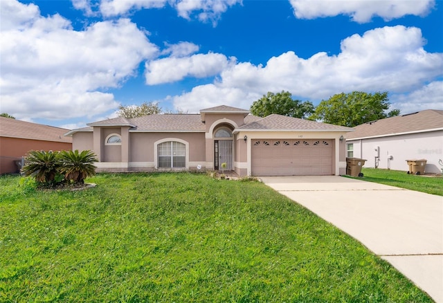 view of front of house with a front yard, concrete driveway, an attached garage, and stucco siding