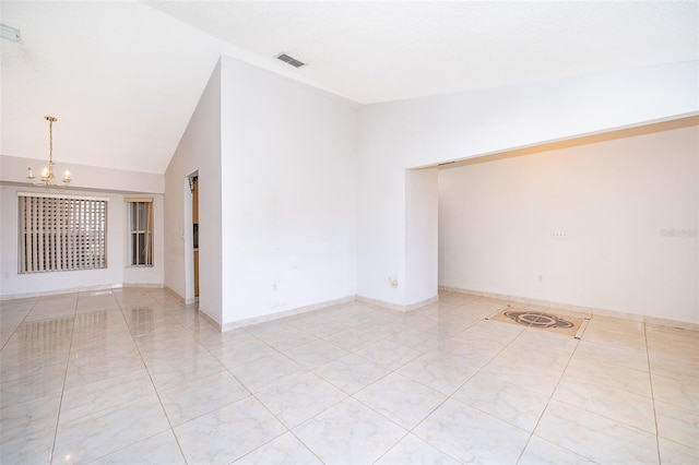 empty room with vaulted ceiling, a notable chandelier, baseboards, and visible vents