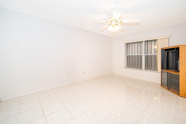 unfurnished living room with a ceiling fan