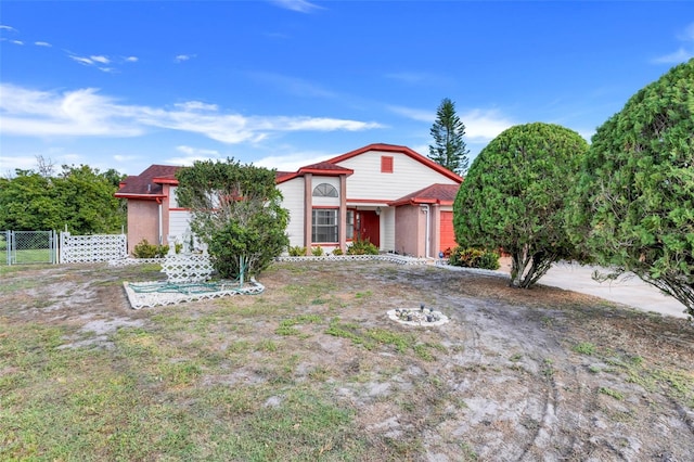 view of front of house with a gate and fence