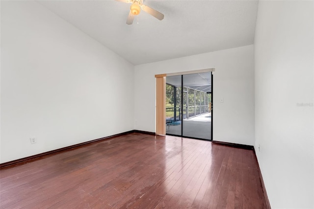 unfurnished room with hardwood / wood-style floors, vaulted ceiling, baseboards, and ceiling fan