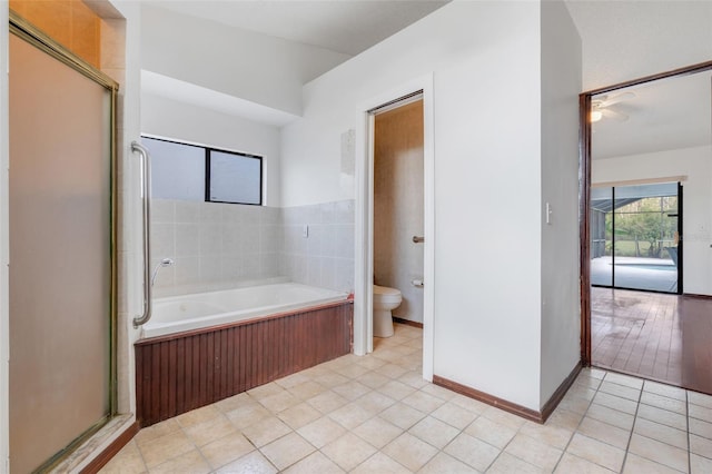 bathroom with tile patterned flooring, a garden tub, toilet, and a shower stall