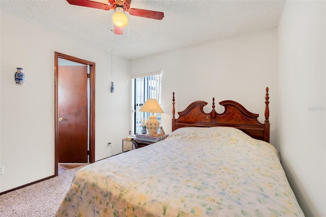 carpeted bedroom with baseboards, a textured ceiling, and ceiling fan