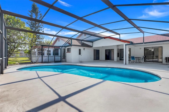 outdoor pool featuring a lanai and a patio area