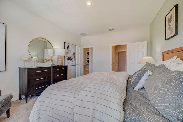 bedroom with light carpet, visible vents, and baseboards