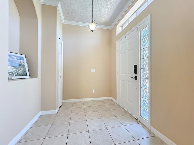 entryway featuring light tile patterned floors, baseboards, a textured ceiling, and crown molding