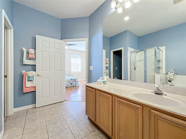 full bathroom with vanity, visible vents, baseboards, tile patterned flooring, and a shower stall