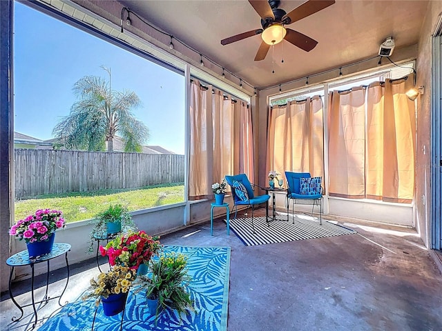 sunroom / solarium with ceiling fan