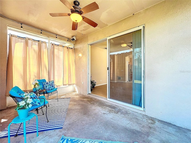 view of patio featuring a ceiling fan