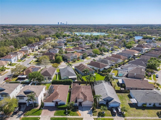 bird's eye view featuring a residential view and a water view